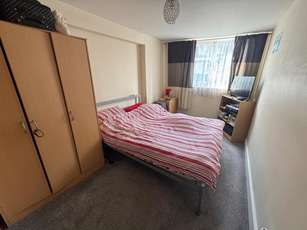 Lot: 11 - FREEHOLD BLOCK OF TWO TWO-BEDROOM GARDEN FLATS - 22 - bedroom 1